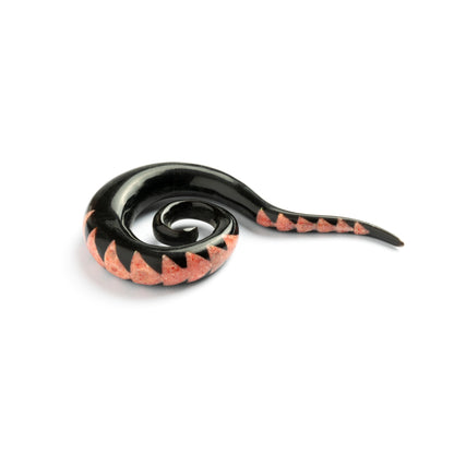 single spiral long hook ear stretcher with pattern of coral inlay triangles side view