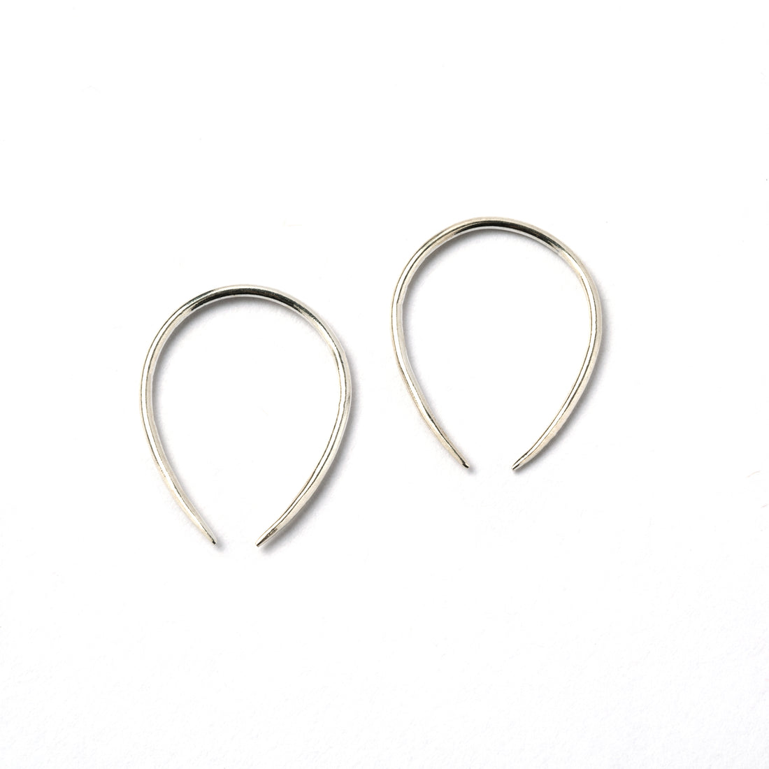 pair of 1mm silver wire horseshoe earrings side view