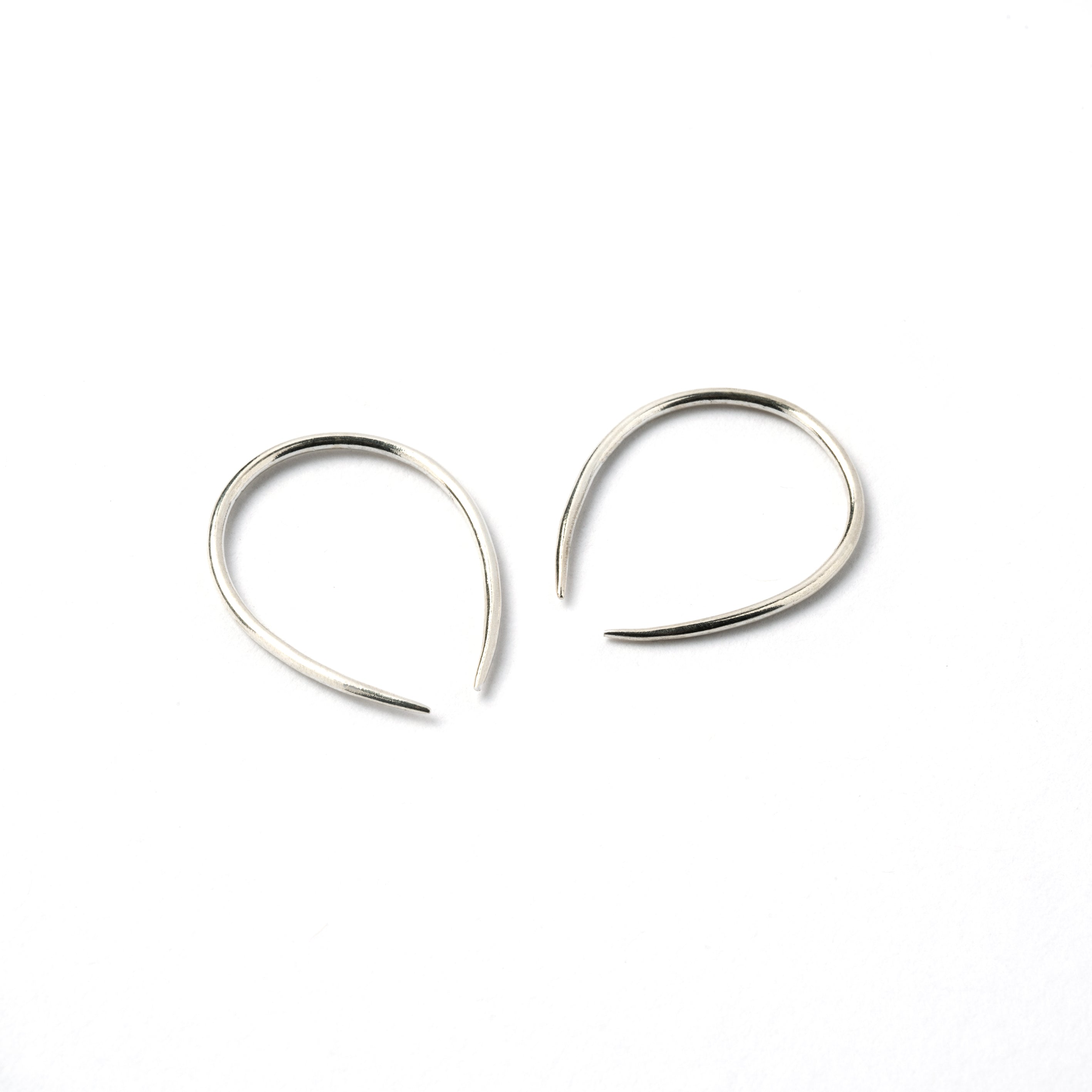 pair of 1mm silver wire horseshoe earrings side view
