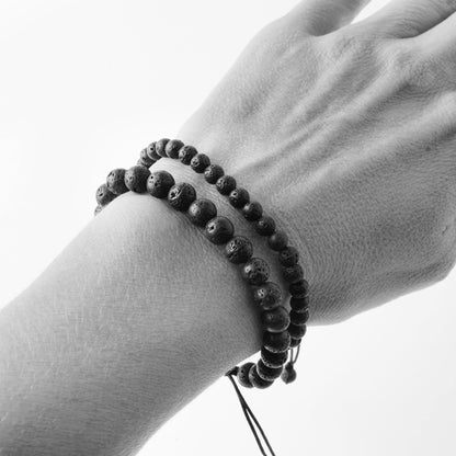 small and medium size Lava bead bracelet on a woman&