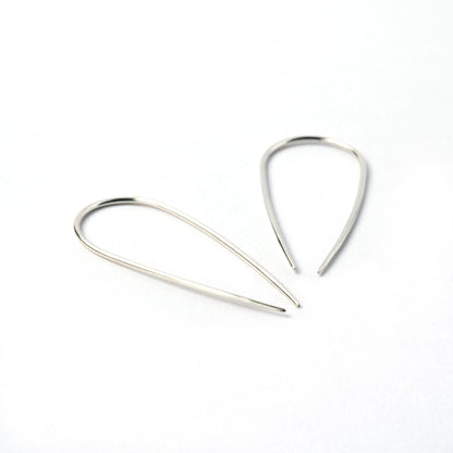 pair of silver wire long horseshoe earrings left side and bottom view