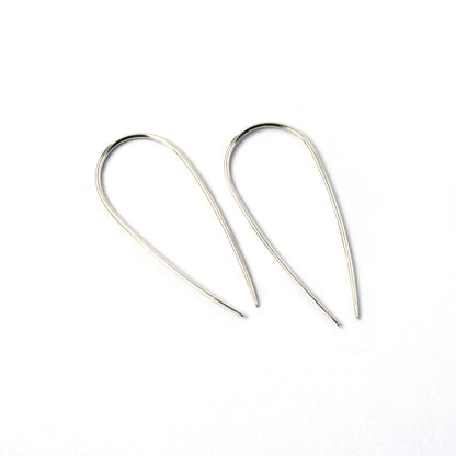 pair of silver wire long horseshoe earrings side view