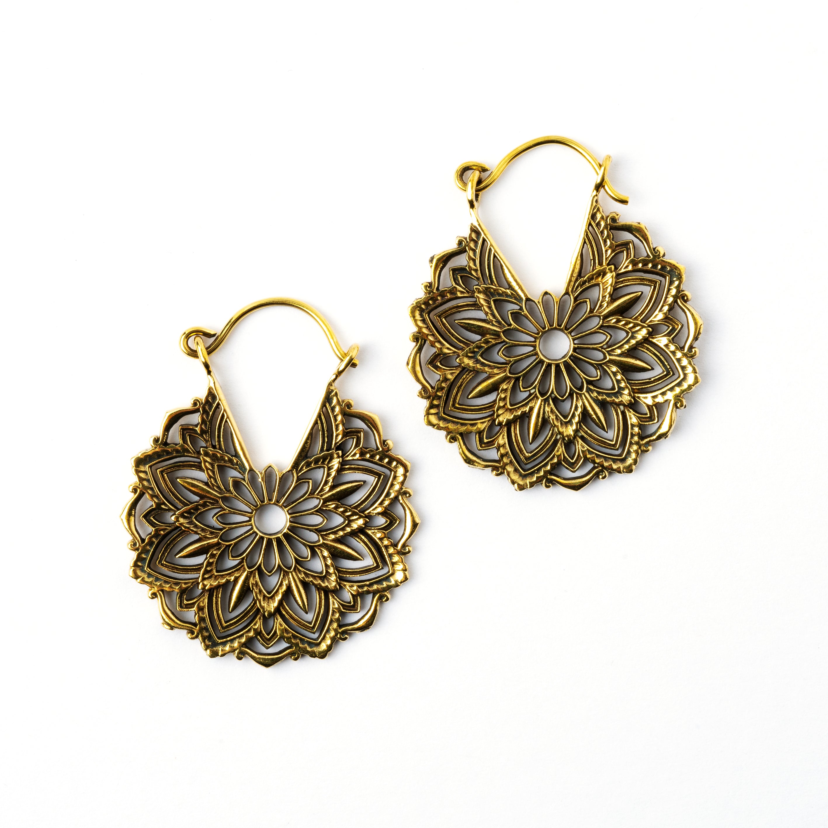 pair of golden brass lotus flower hoop earrings frontal view