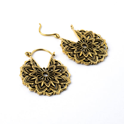 pair of golden brass lotus flower hoop earrings right side view