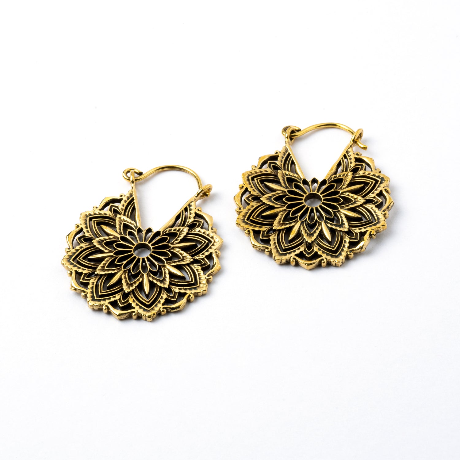 pair of golden brass lotus flower hoop earrings left side view