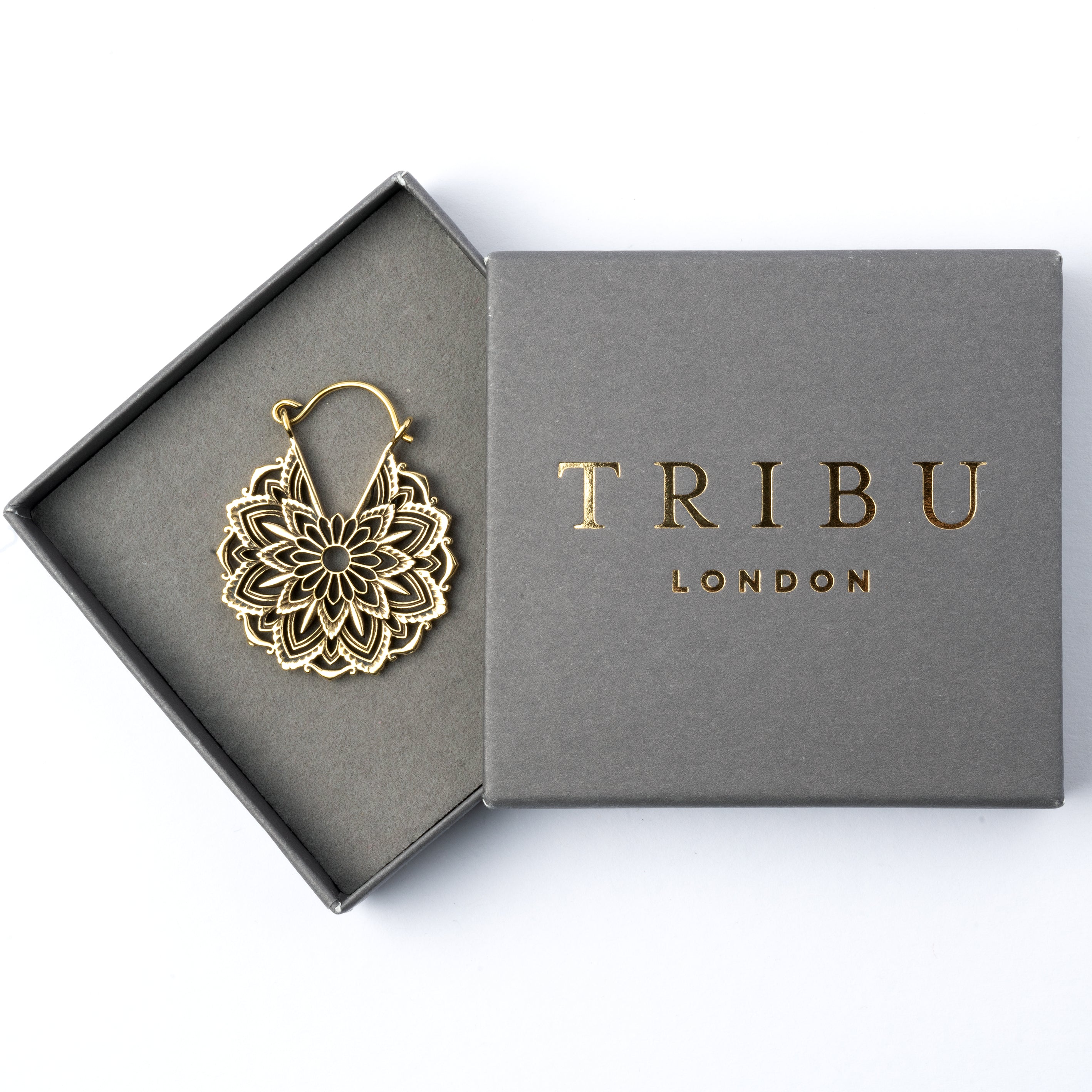 single golden brass lotus flower hoop earring in a gift box