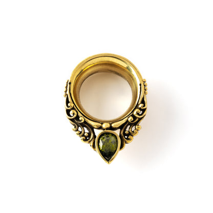 victorian design of golden ear plugs tunnel in teardrop shape with peridot gem