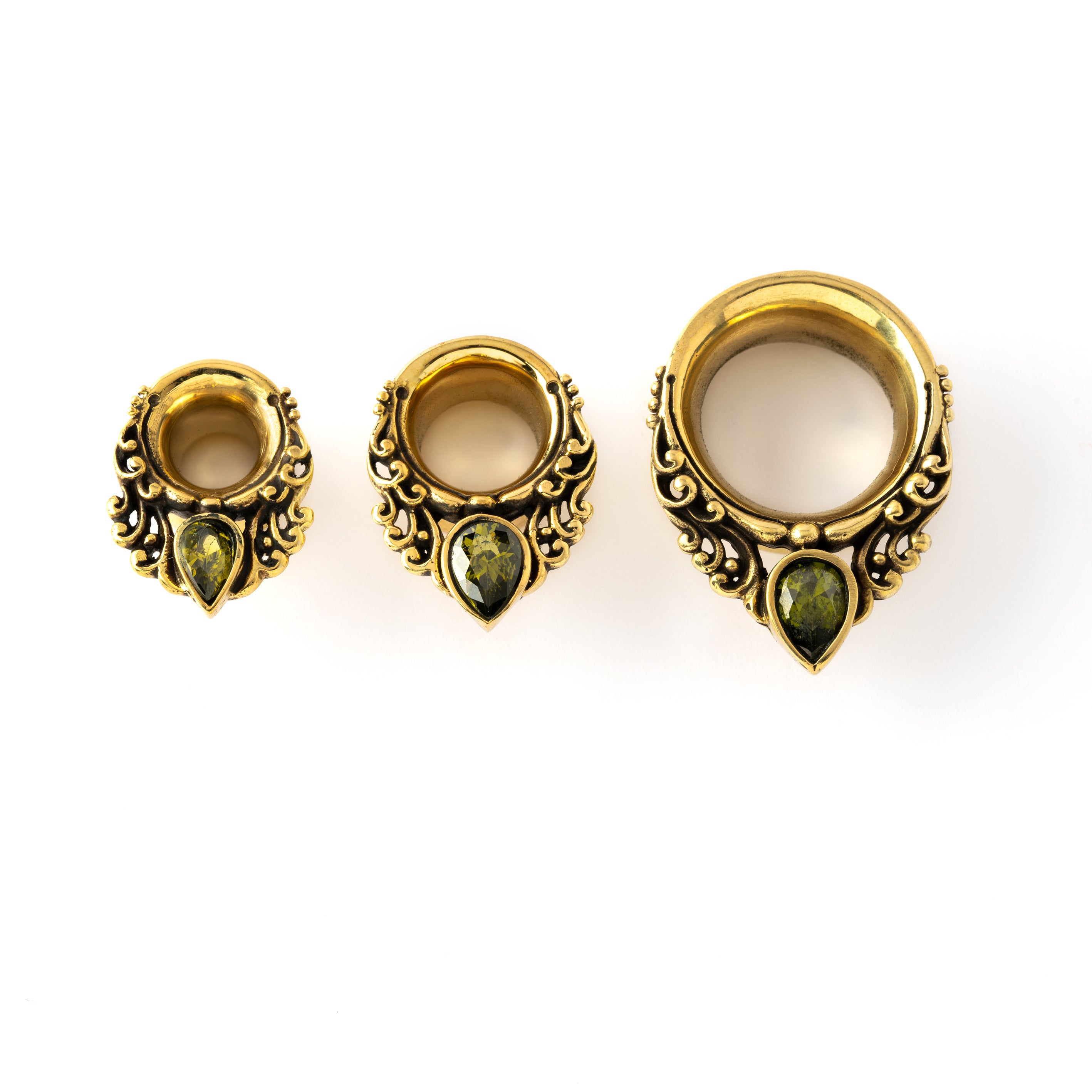 different sizes of golden victorian ear plugs tunnel in teardrop shape with peridot gem