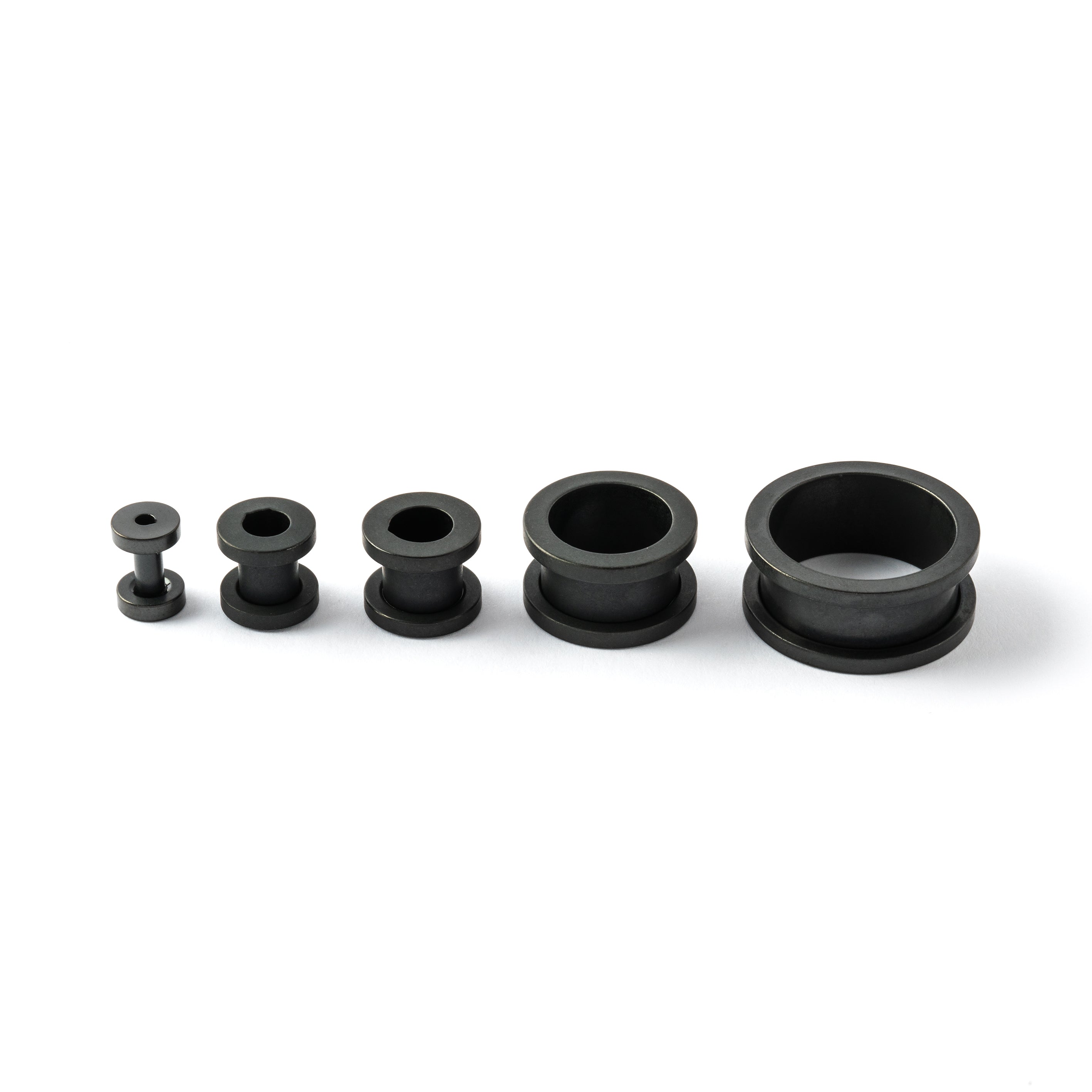 several sizes of surgical steel matte black ear tunnels side view