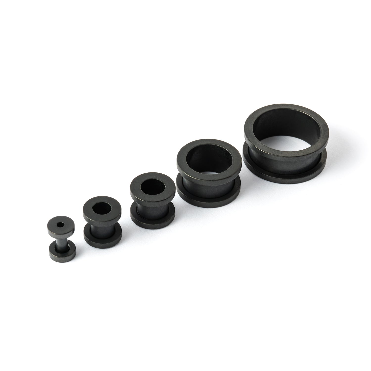 several sizes of surgical steel matte black ear tunnels side and front view