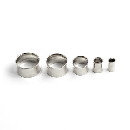 different sizes of minimalistic plain Silver ear tunnel left side view