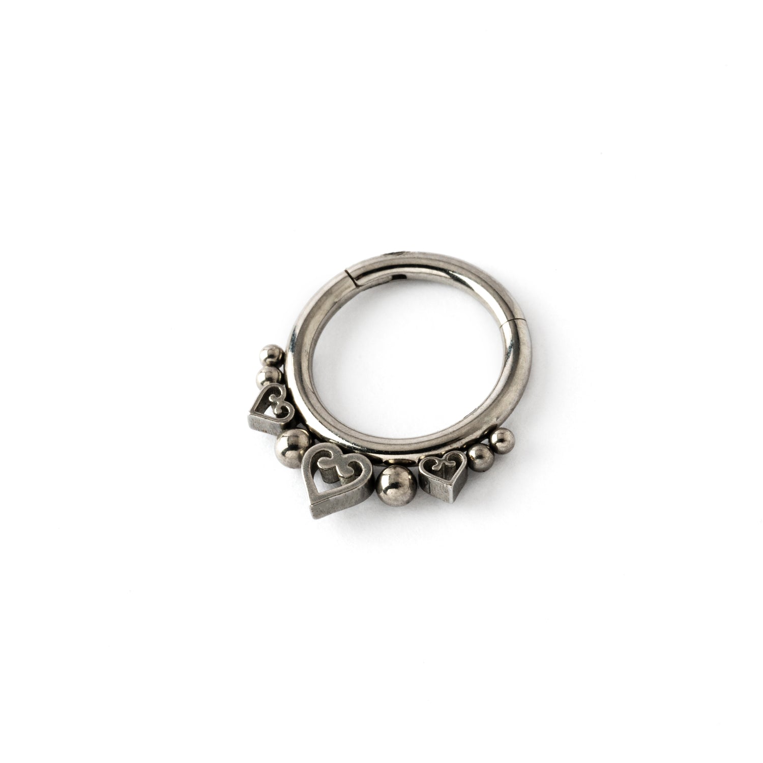surgical steel hinged segment ring with spheres and hearts ornaments left side view