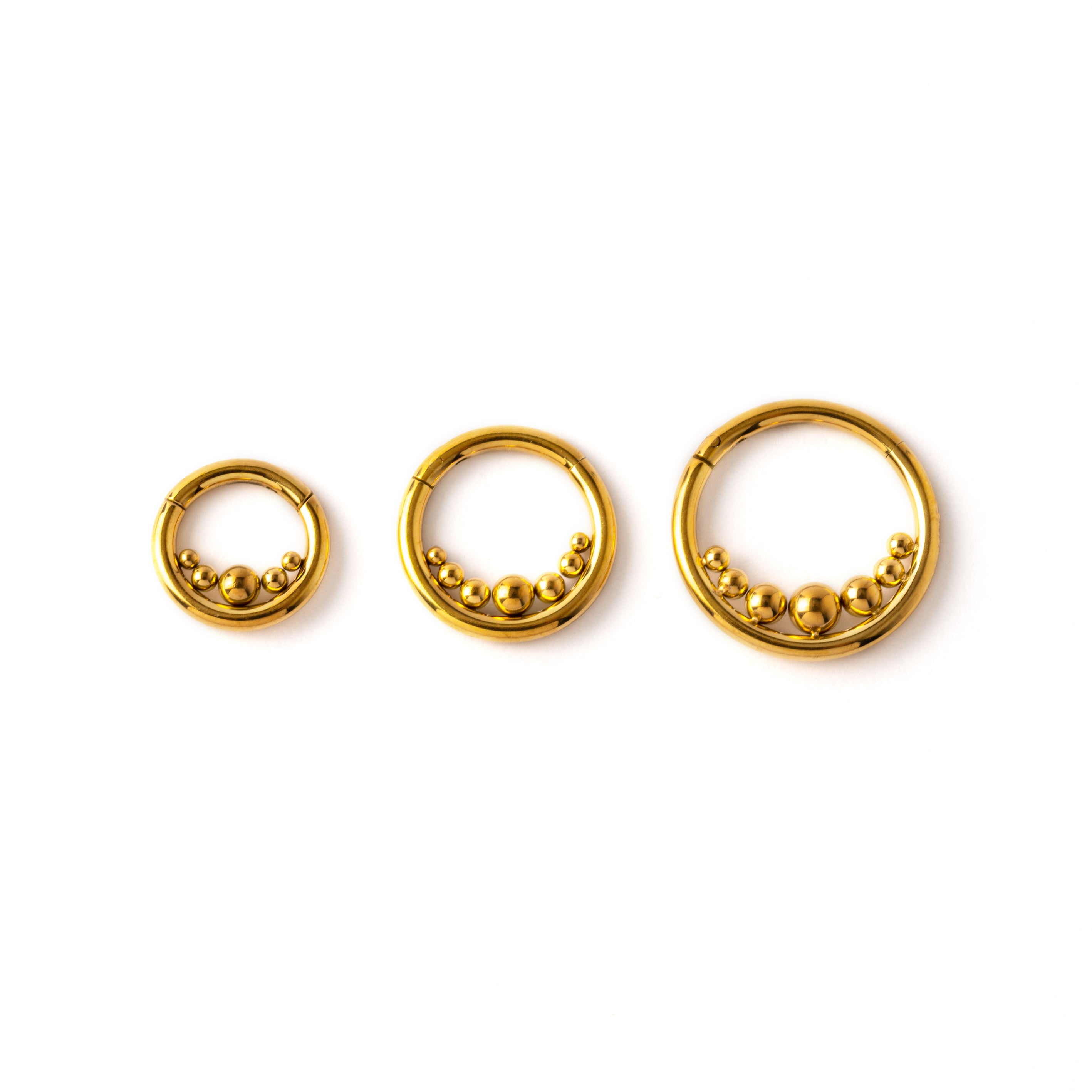 6mm, 8mm and 10mm Newton's Cradle gold surgical steel clicker piercing rings frontal view