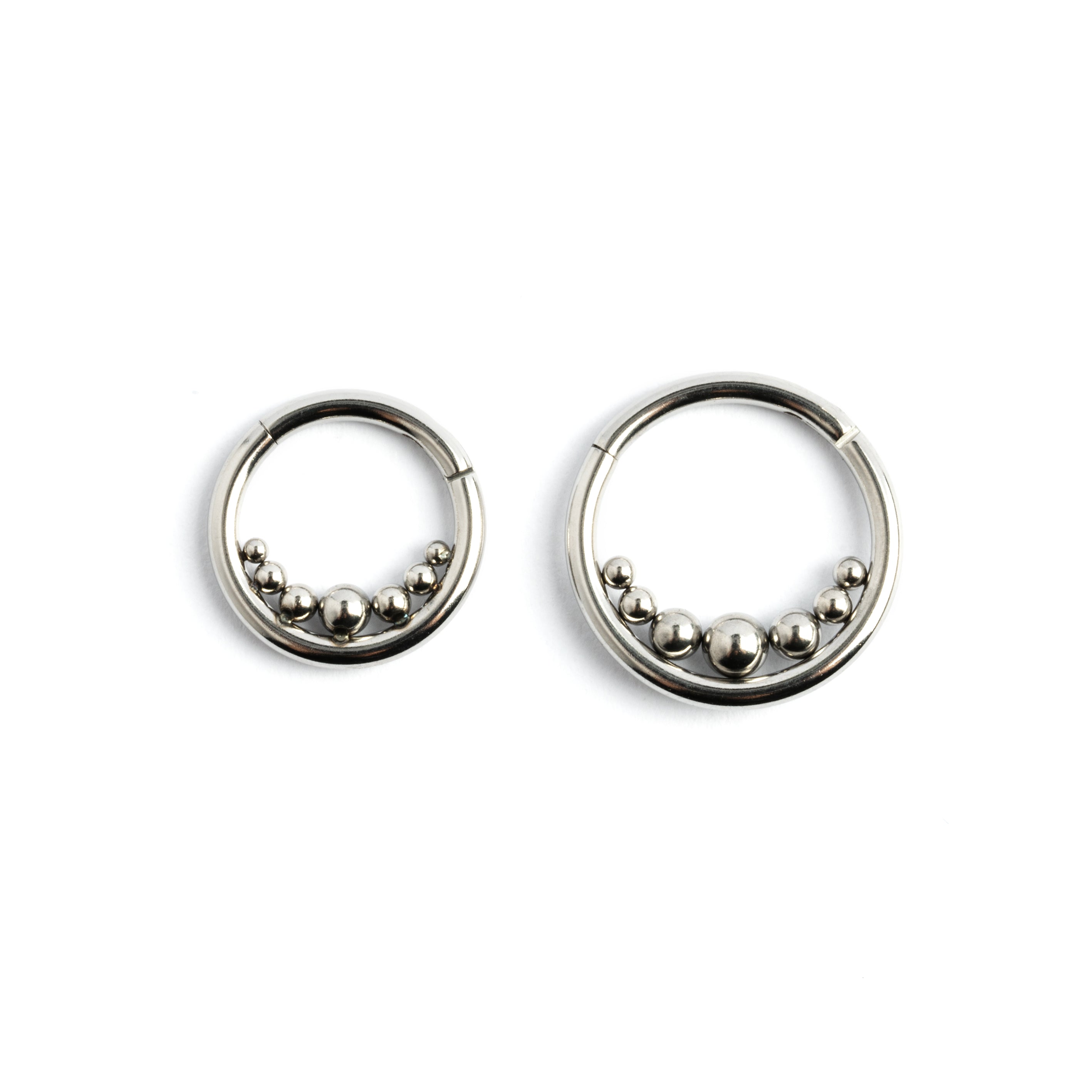 8mm and 10mm Newton's Cradle surgical steel clicker piercing rings frontal view