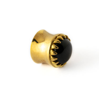 golden ear plug crown shaped with centred black obsidian side view