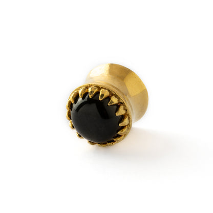 golden ear plug crown shaped with centred black obsidian side view