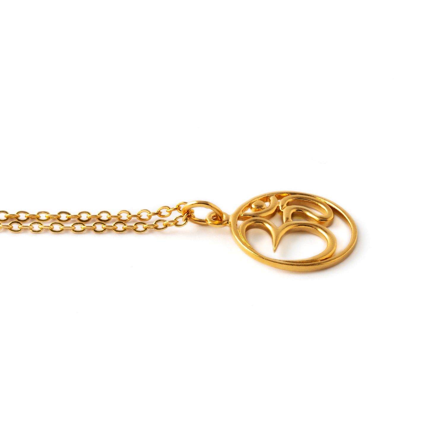 Gold Om stamp necklace on a chain side view