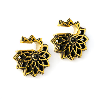 pair of antique gold colour geometric flower ear weights hangers with black onyx left side view