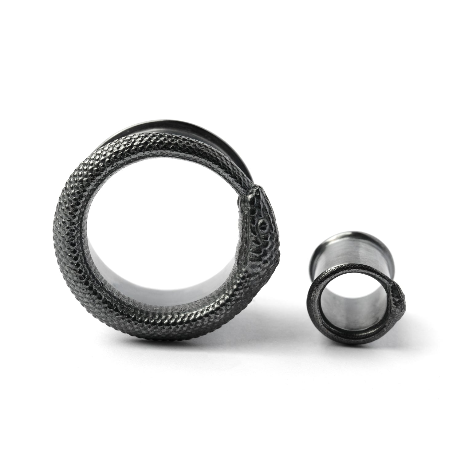 two sizes Ouroboros black silver ear tunnels frontal view