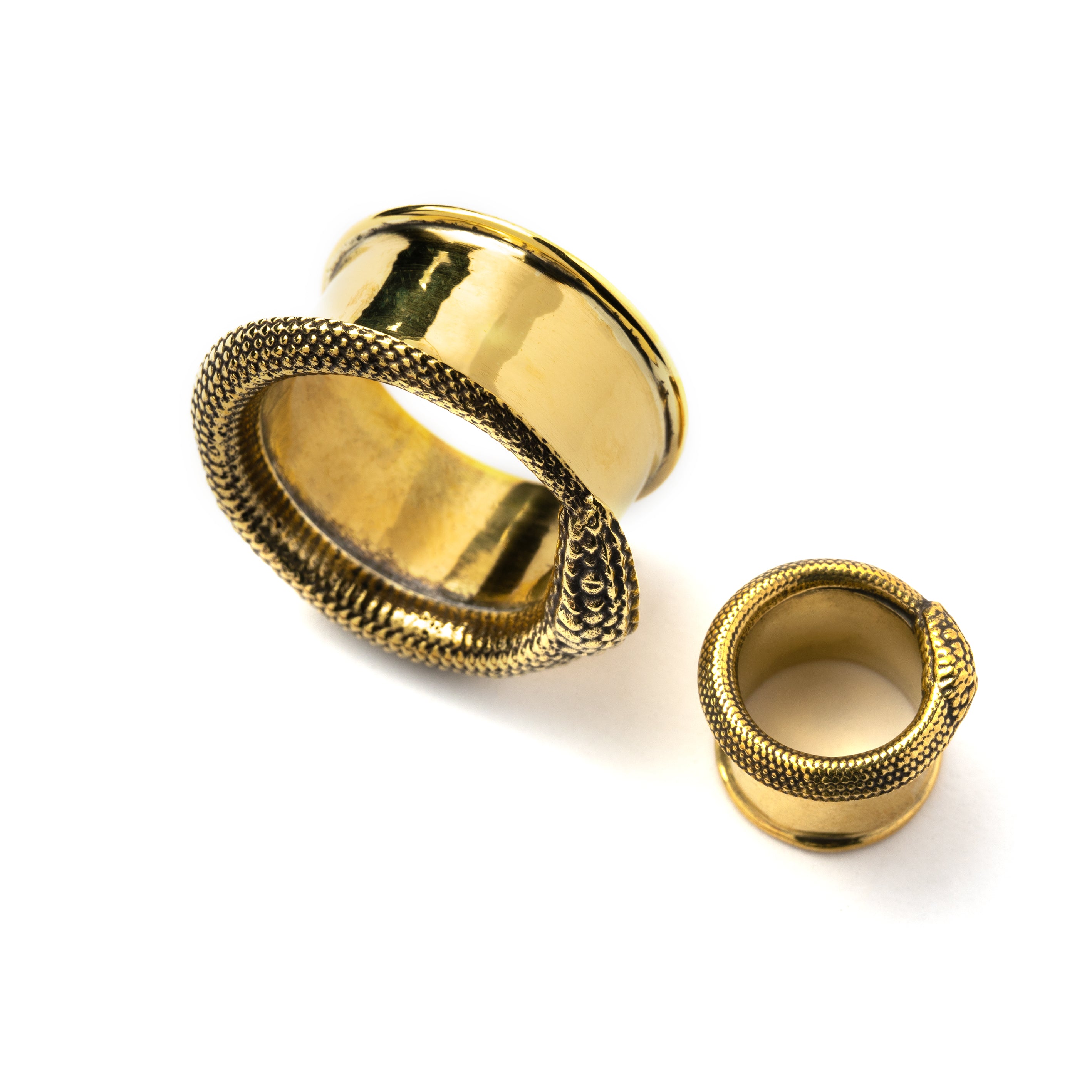two sizes of Ouroboros golden brass ear tunnels above view