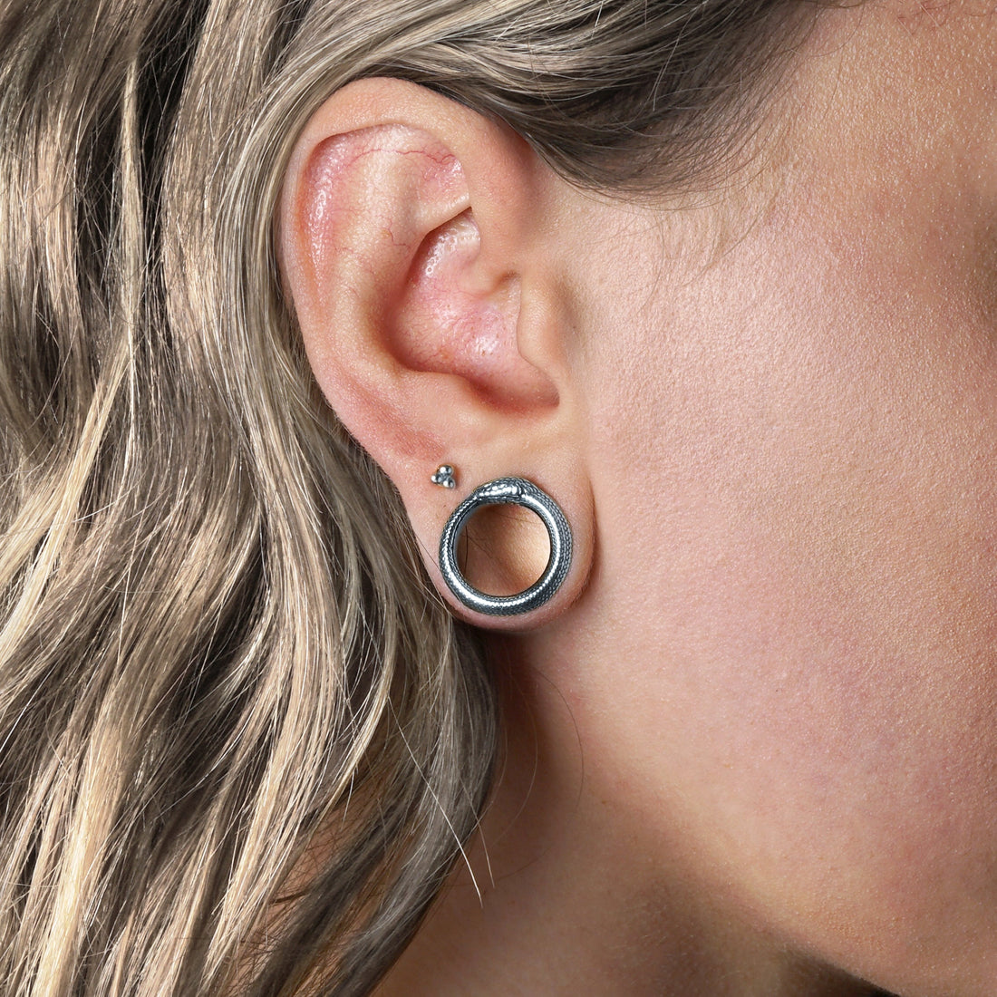 model wearing Ouroboros Silver Tunnels
