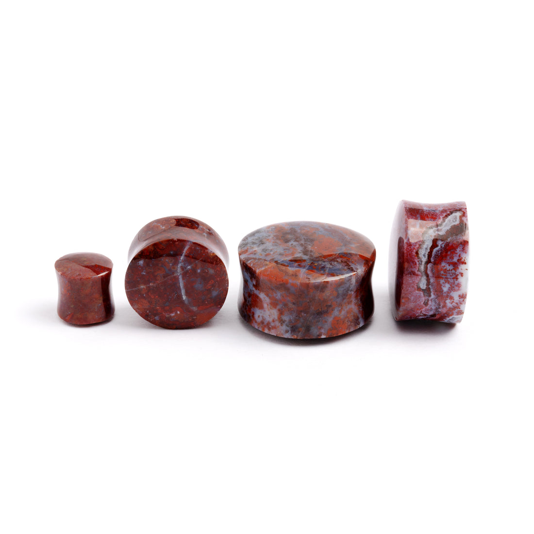 several sizes of Poppy Jasper double flare stone ear plugs side and front view