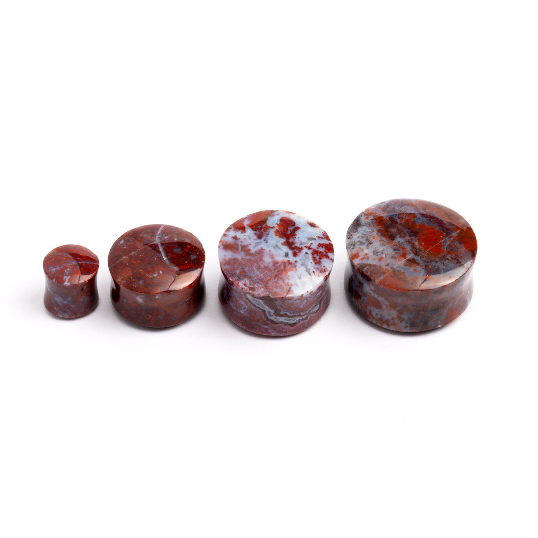 several sizes of Poppy Jasper double flare stone ear plugs front view