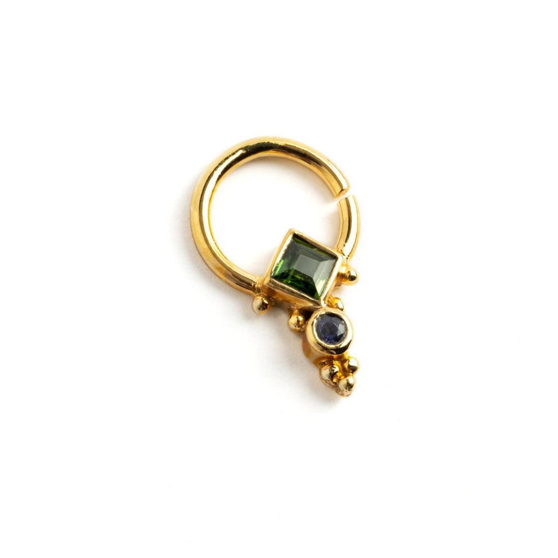 A beautiful settings of Tourmaline and Lolite septum ring, hand crafted with 925 silver and 18k gold plating finish. Rabia-Gold-Septum-with-Turmaline-and-Iolite_3Rishi Gold Septum - Tourmaline and Lolite right side view