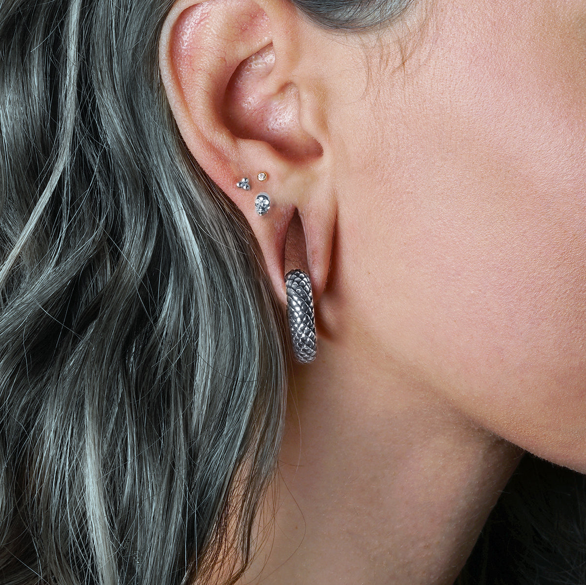 model wearing Rebirth Silver Weight Hoops