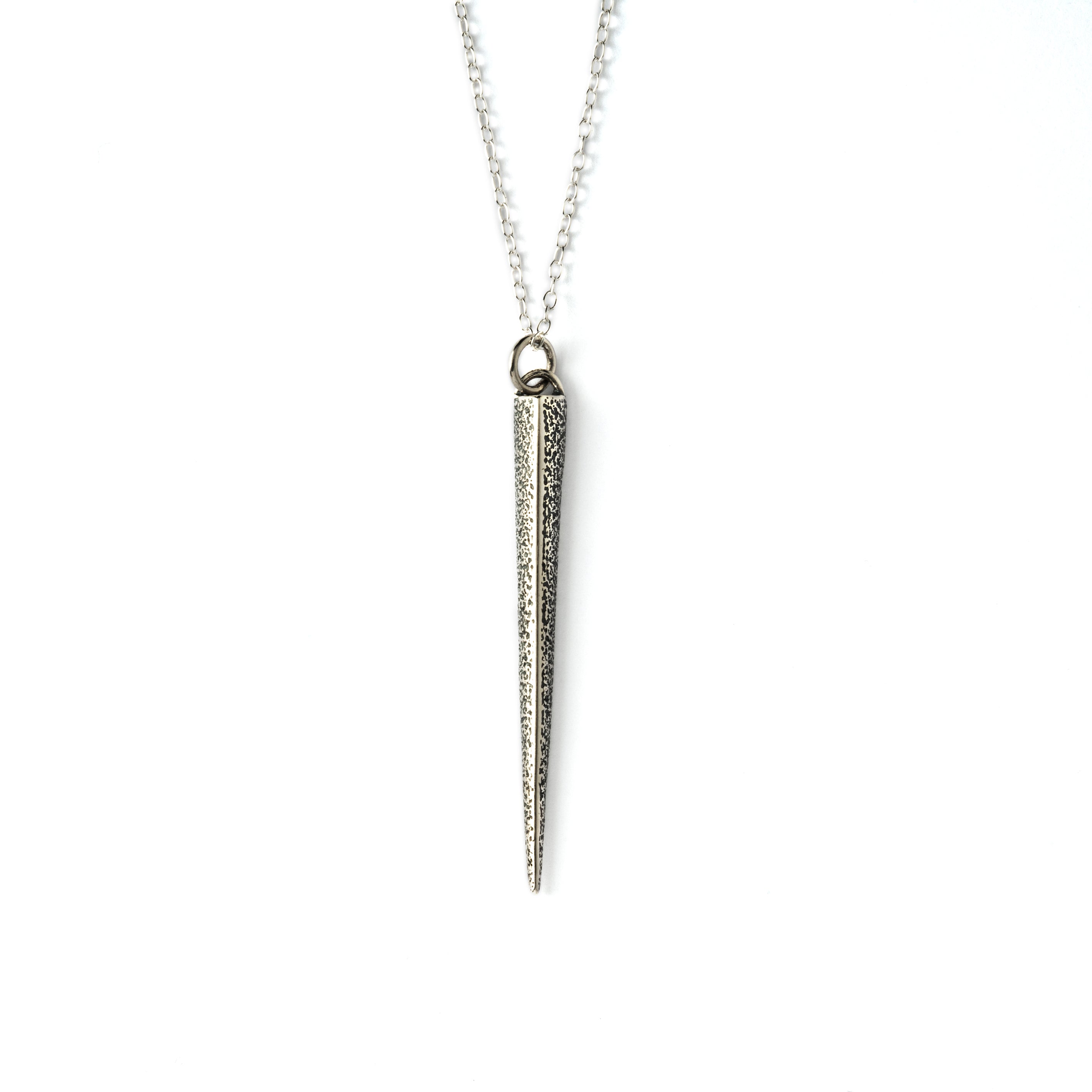 textured silver ridged spike pendant on a chain front view