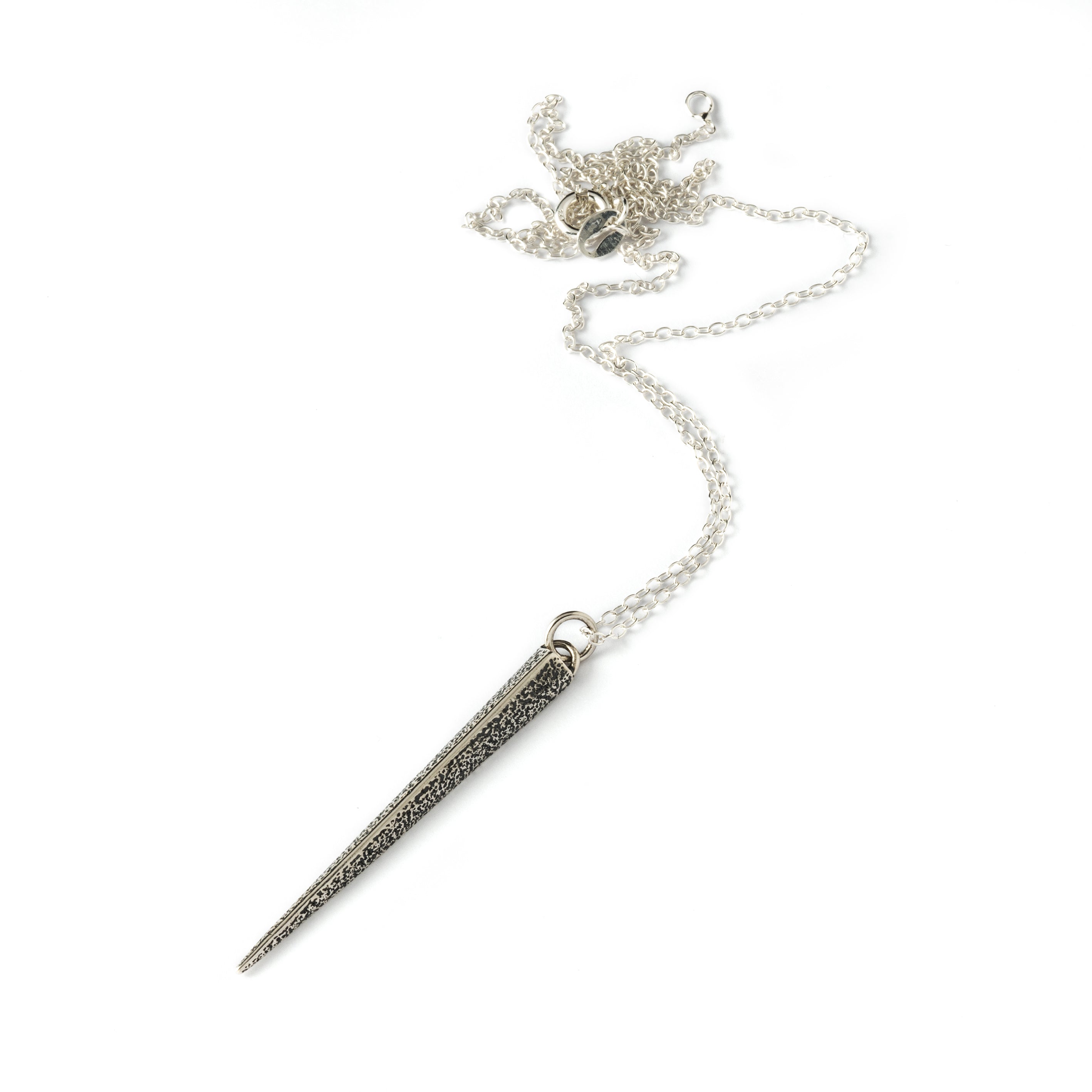 textured silver ridged spike pendant on a chain 