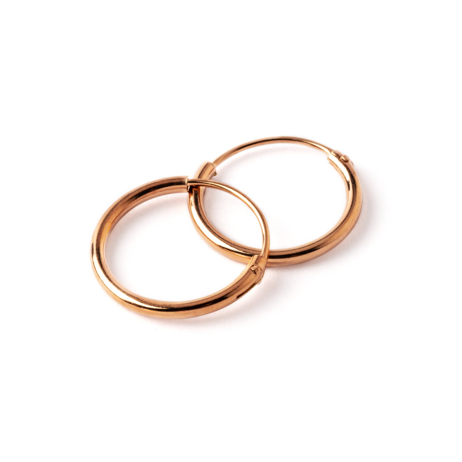 pair of rose gold hoop earrings 