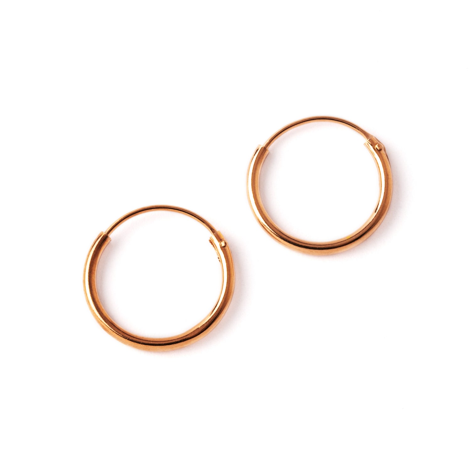 pair of rose gold hoop earrings frontal view