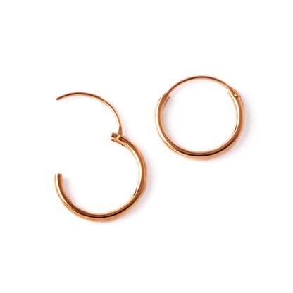 pair of rose gold hoop earrings closure view