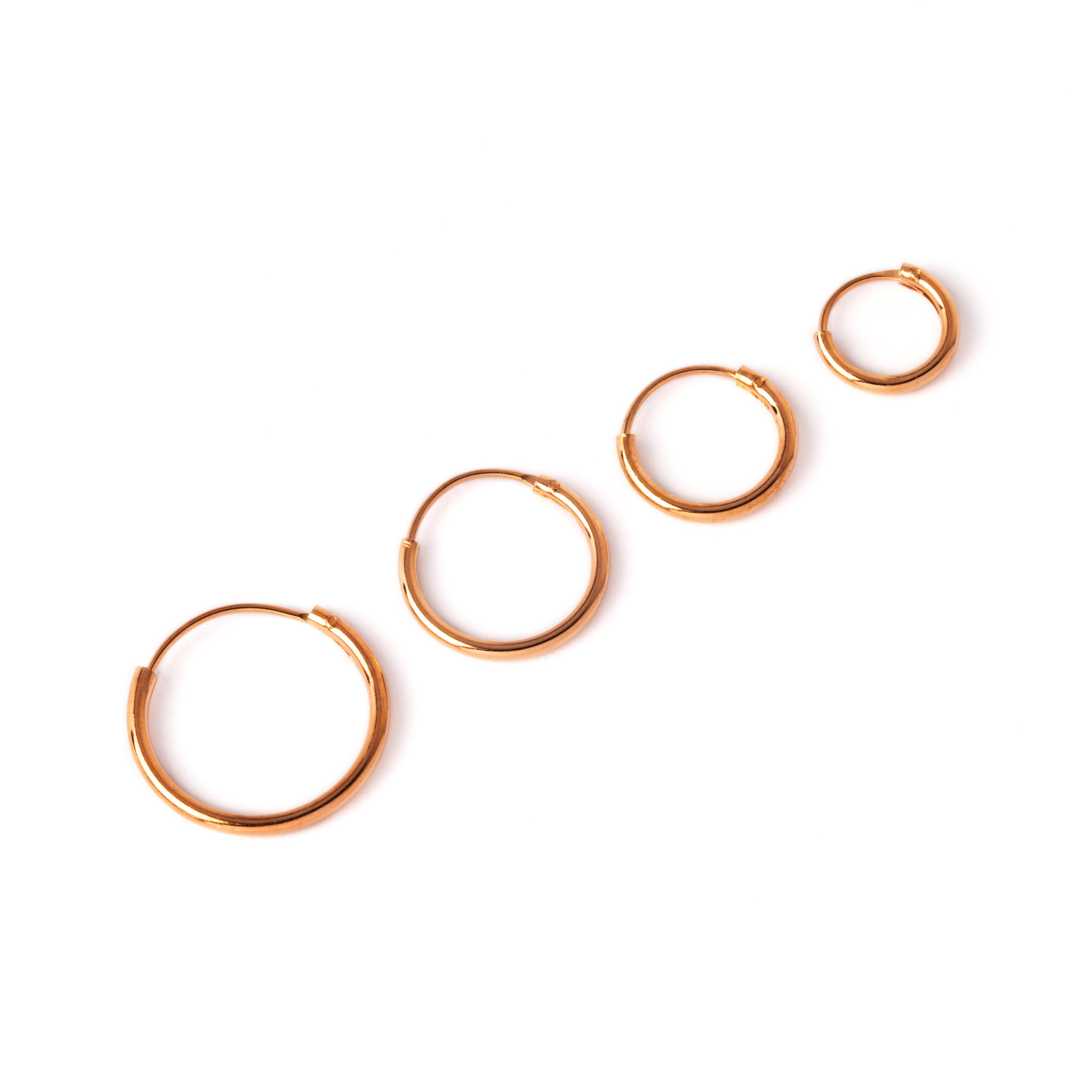 all sizes rose gold hoop earrings side view