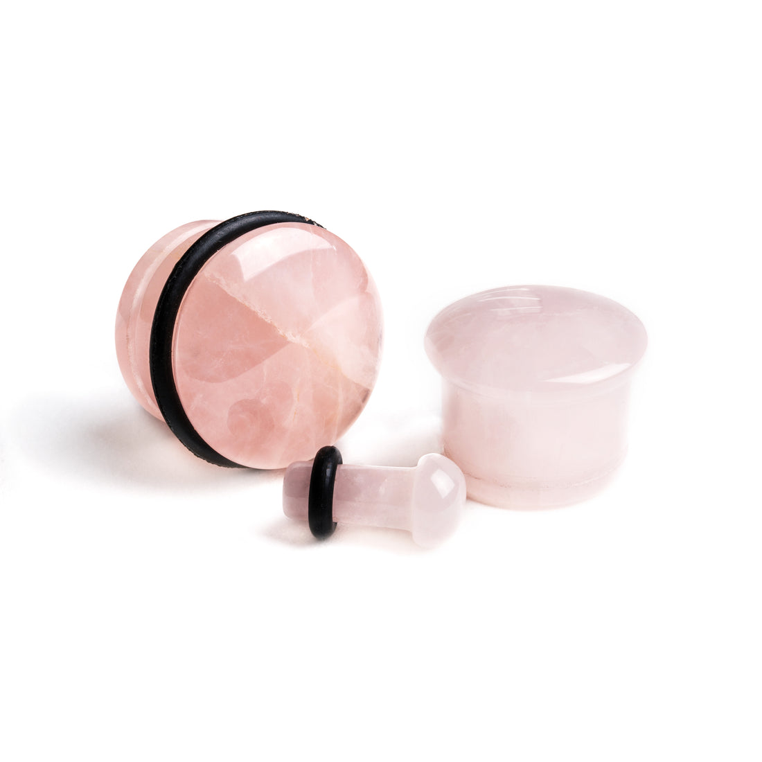 several sizes of single flare rose quartz stone ear plugs front and side view