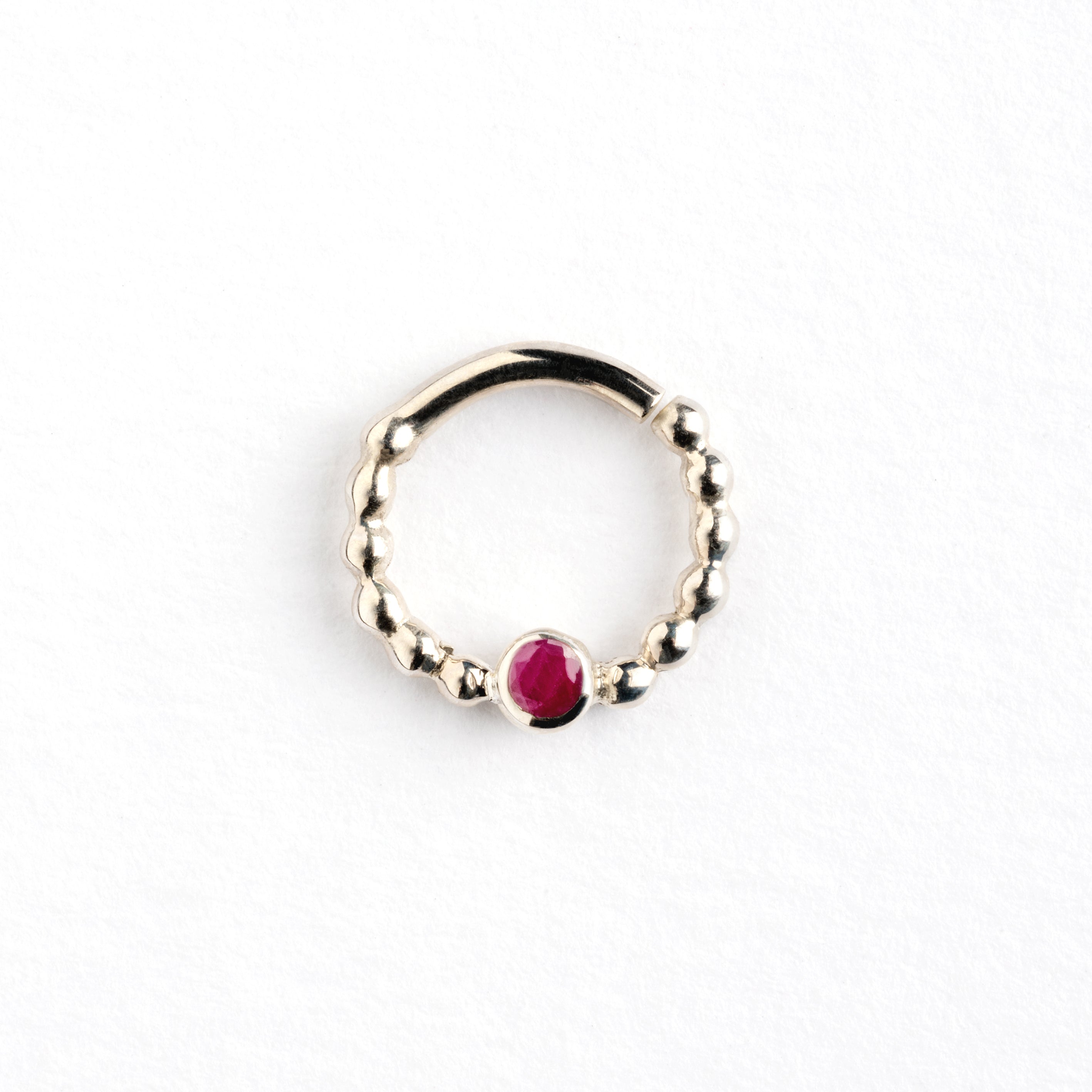 sterling silver dotted septum ring with ruby gemstones frontal view