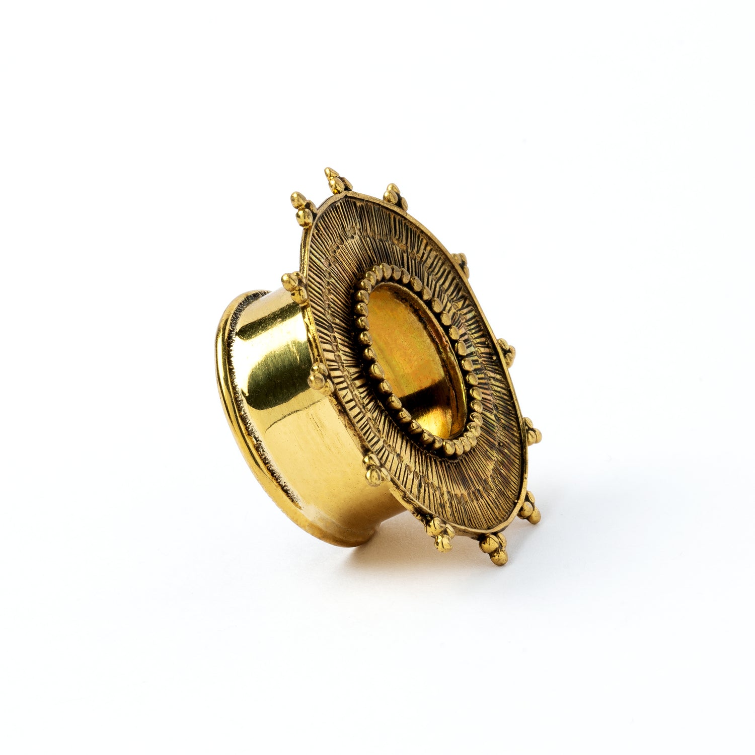 Rustic sun golden brass ear tunnel for stretched ears side view
