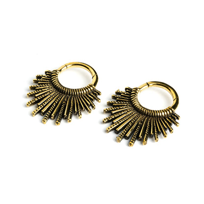 pair of gold brass tribal sun hoops hangers left side view