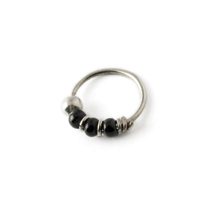 Silver nose ring with black onyx beads left side view