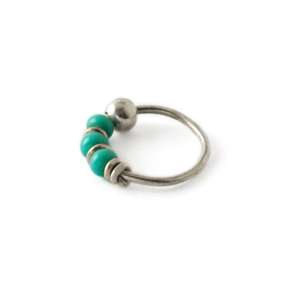 Silver nose ring with turquoise beads side view