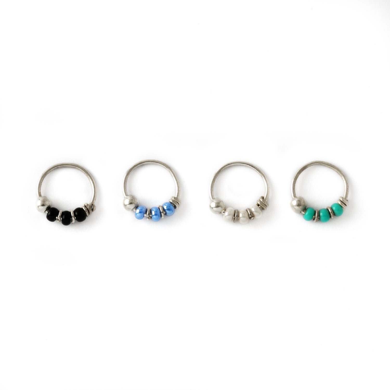 Silver nose rings with different types beads frontal view