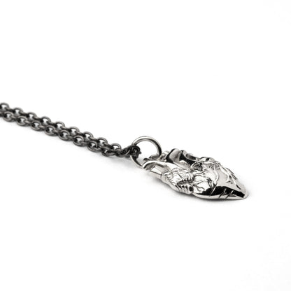 sterling silver anatomical heart charm necklace on a silver chain side view