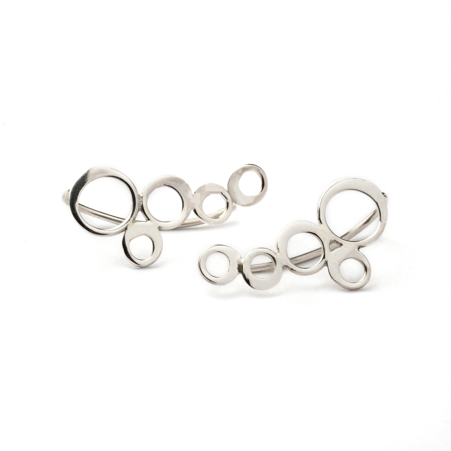 pair of silver circles ear climbers frontal view
