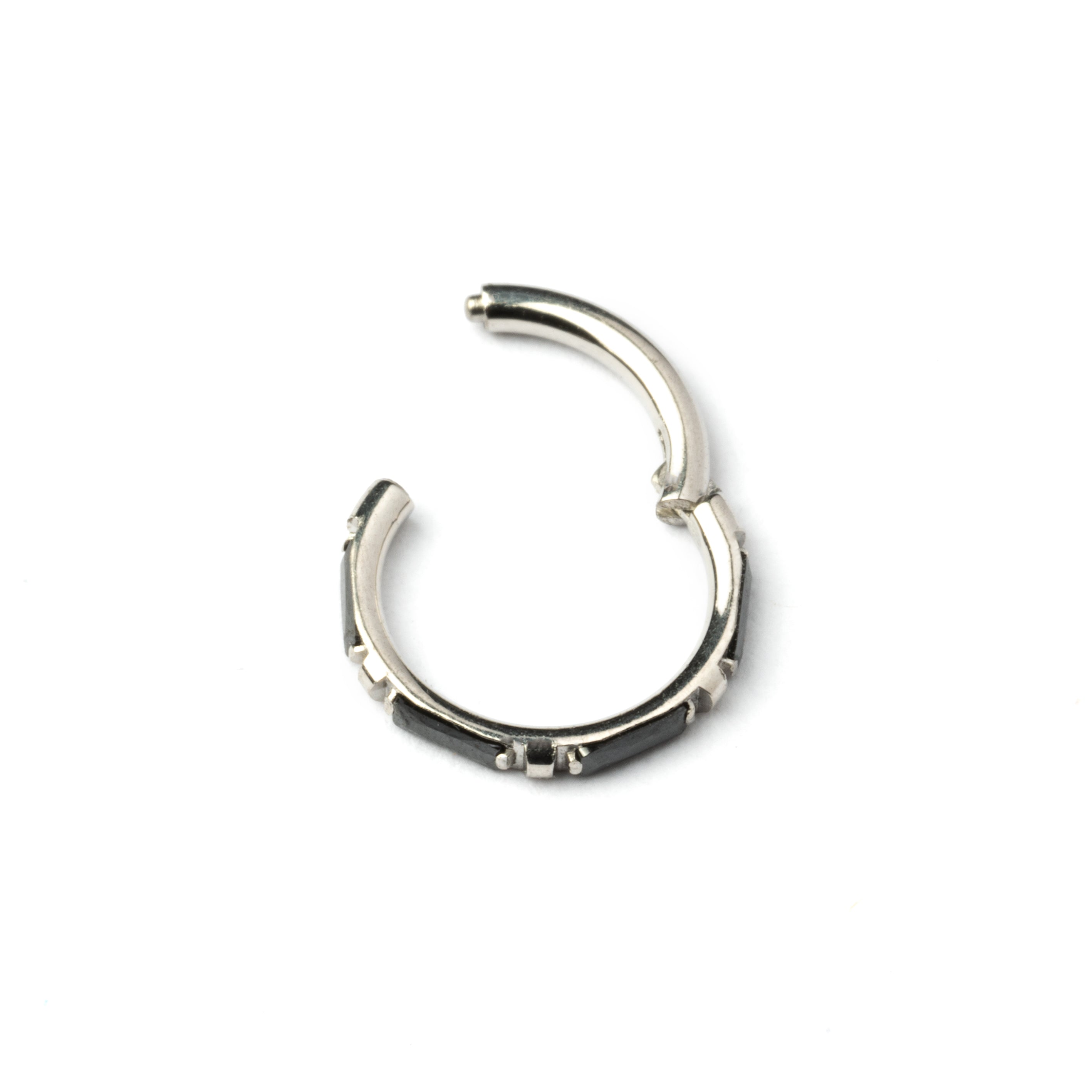 surgical steel septum clicker with black onyx stones around its rim frontal closure view