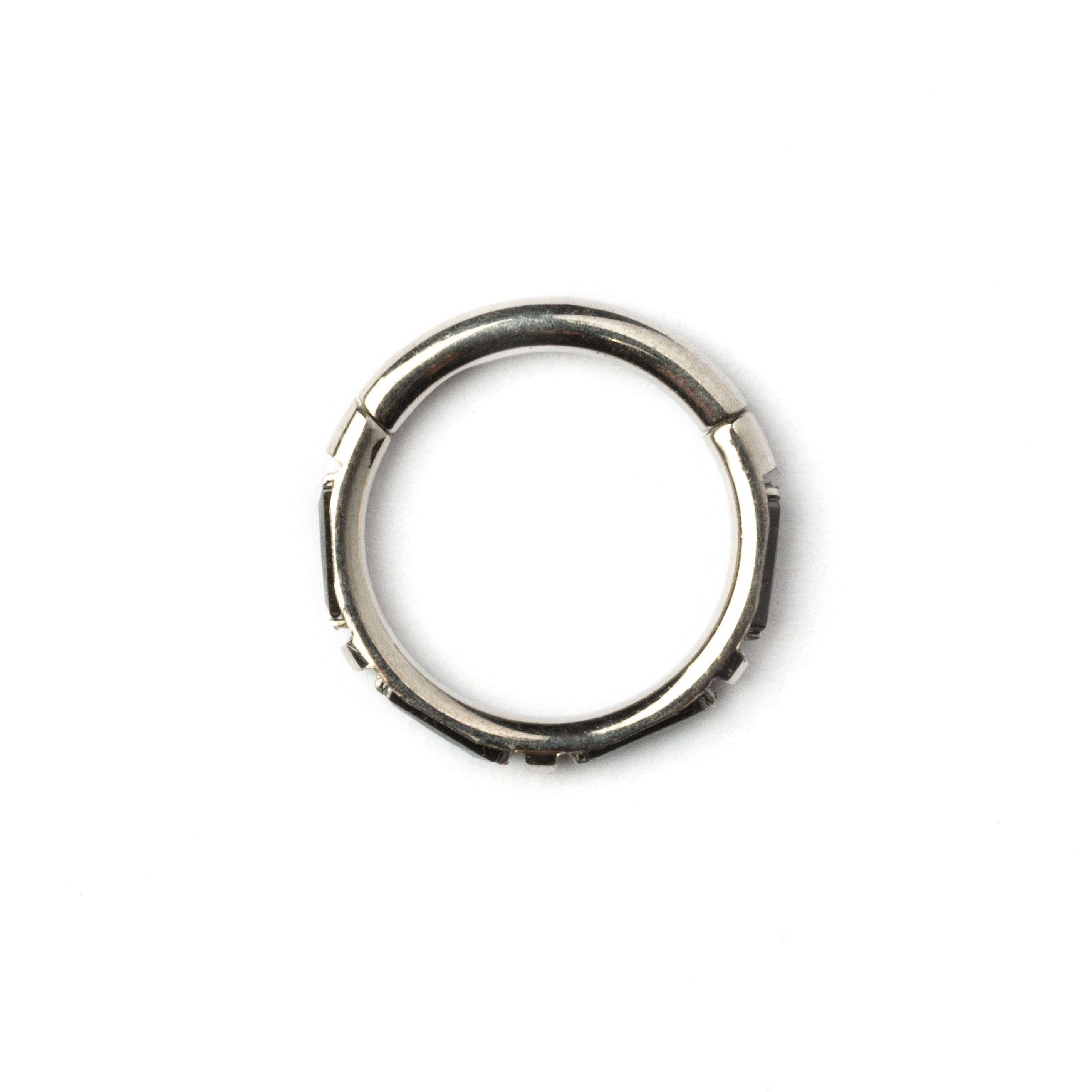 surgical steel septum clicker with black onyx stones around its rim side view