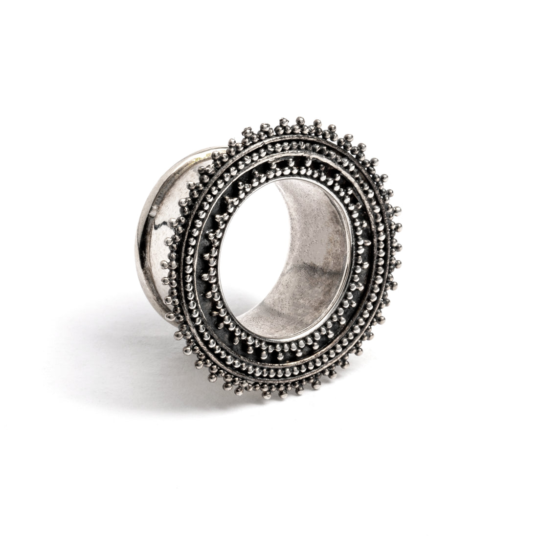 single silver Indian ear tunnel right front view