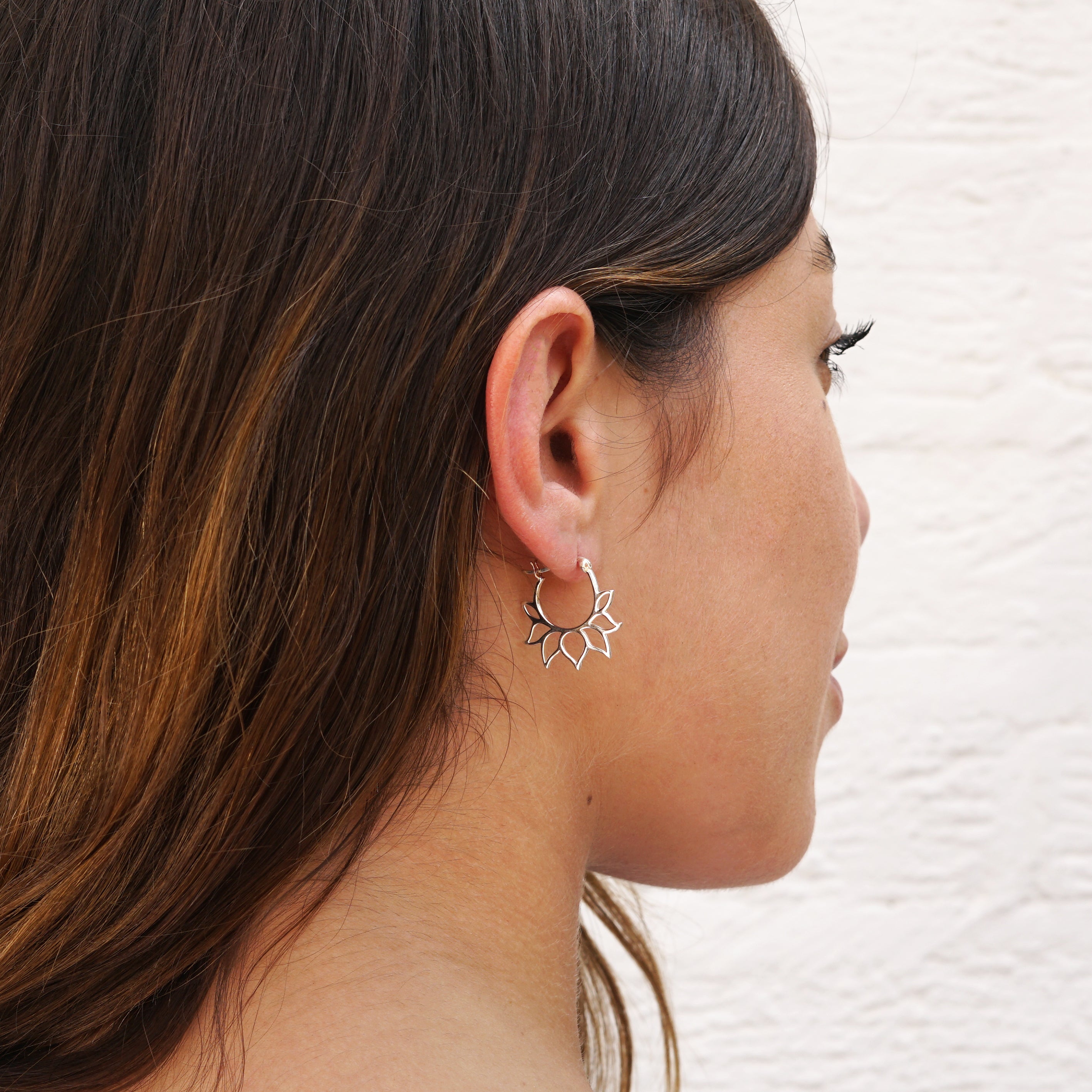 model wearing Silver Lotus Petal Hoops 