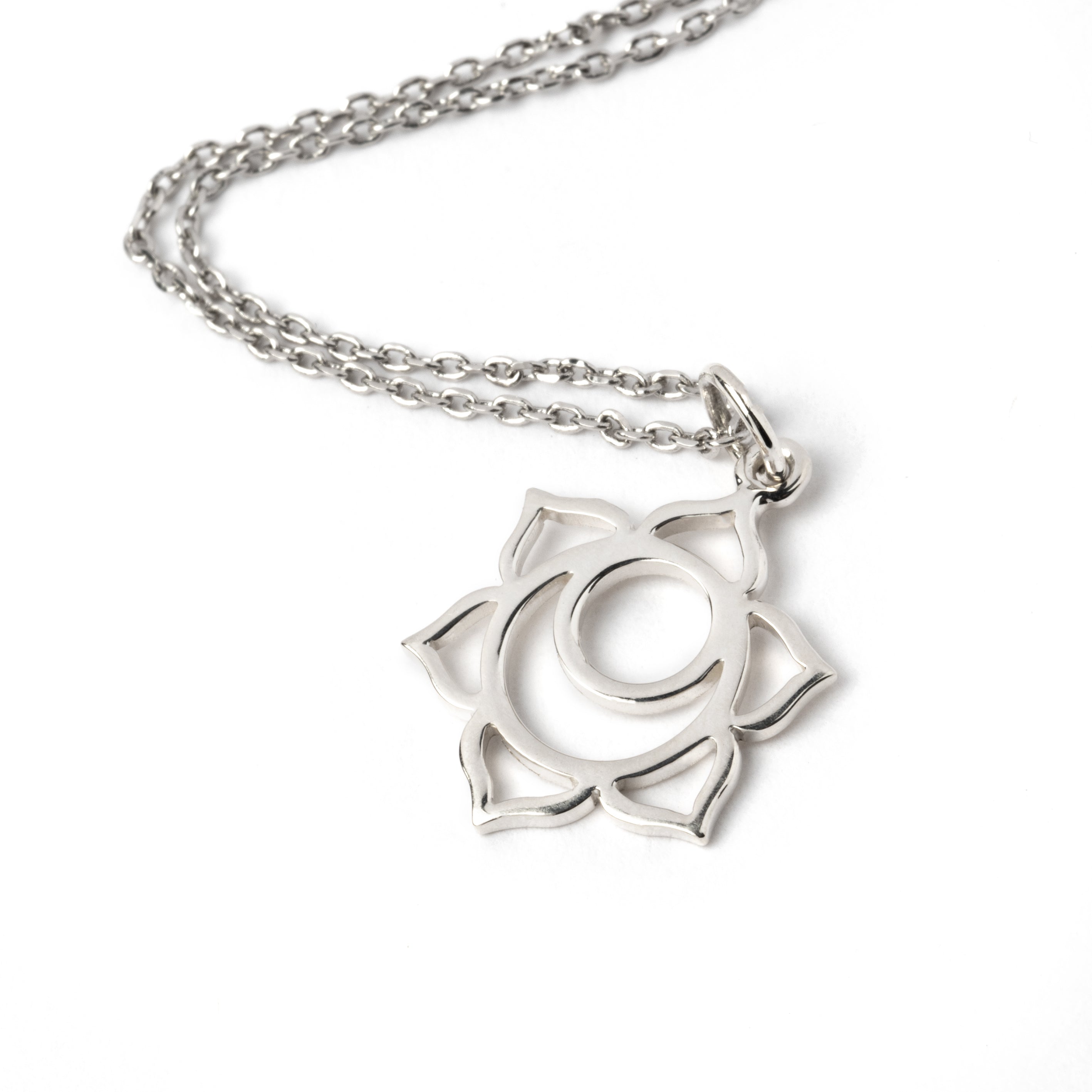 Sterling Silver Sacral Chakra Charm Necklace. The sacral chakra is the second chakra out of seven in the body's energy system, it is also known as the sexual Chakra and relates to greater harmony around sexuality, emotional balance & creativity.  This Chakra charm is part of the seven chakras pendents collection, please check out our necklaces category to see more chakra pendents.  Material : 925 sterling silver Dimensions : 22mm by 14mm Comes on a matching chain.
