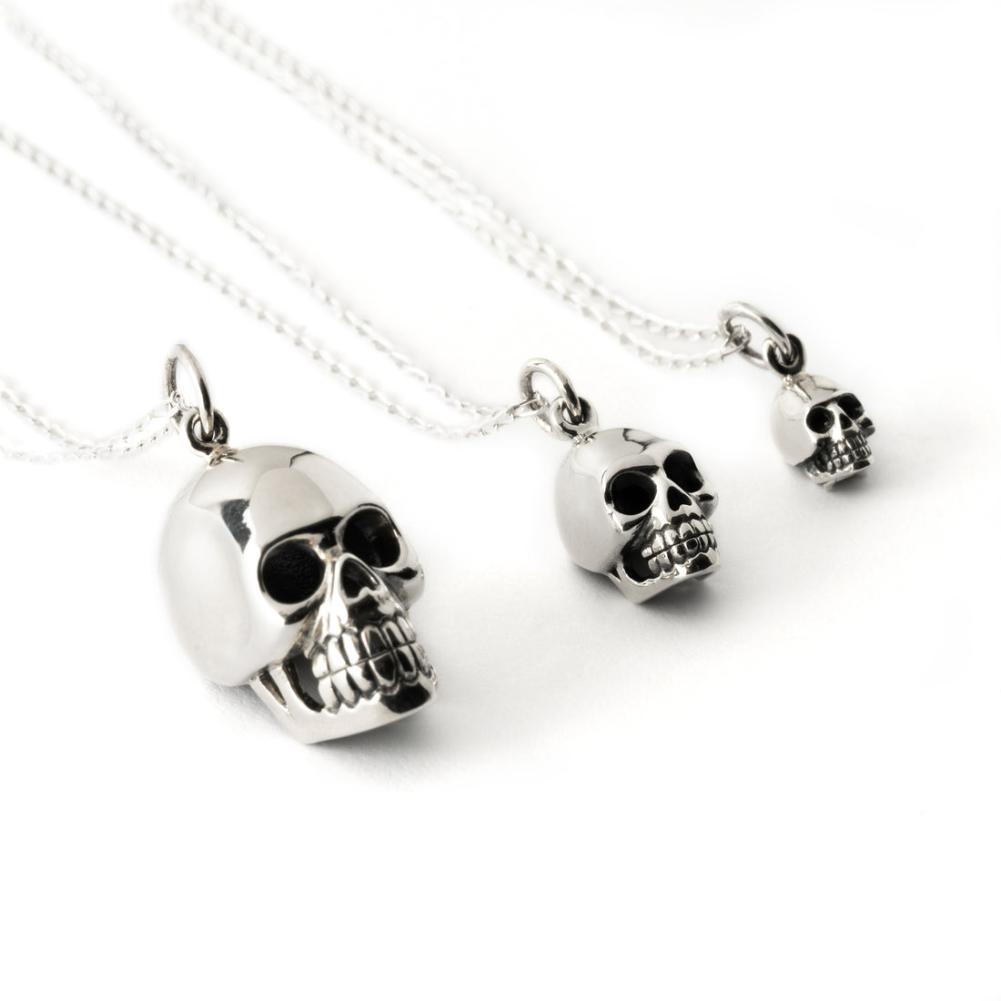 three sizes of Silver Skull Charm Necklace side view